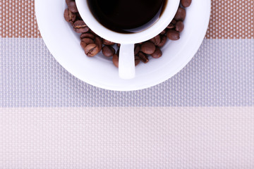 Cup of fresh hot coffee on table cloth