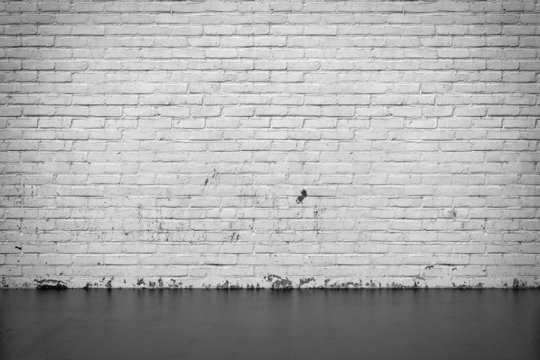 Background interior: brick wall and concrete floor