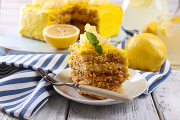 Tasty lemon dessert on wooden table