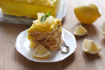 Tasty lemon dessert on wooden table