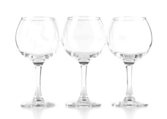 Empty wine glasses isolated on white