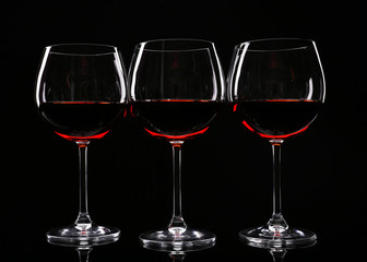 Glasses of wine isolated on black