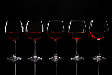 Glasses of wine isolated on black