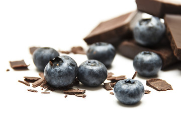Blueberries with chocolate isolated on white background