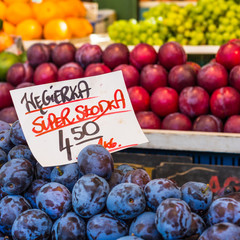 Plums on the market stand in Poland.