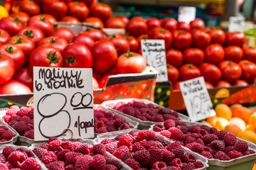 Red raspberries in boxes at local farm market in Poland.