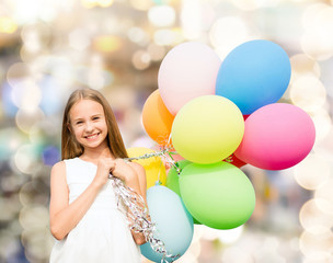 happy girl with colorful balloons