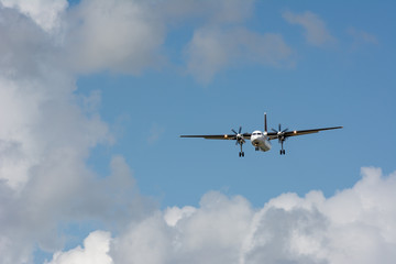 Fototapeta na wymiar unidentified plane on landing approach at amsterdam airport