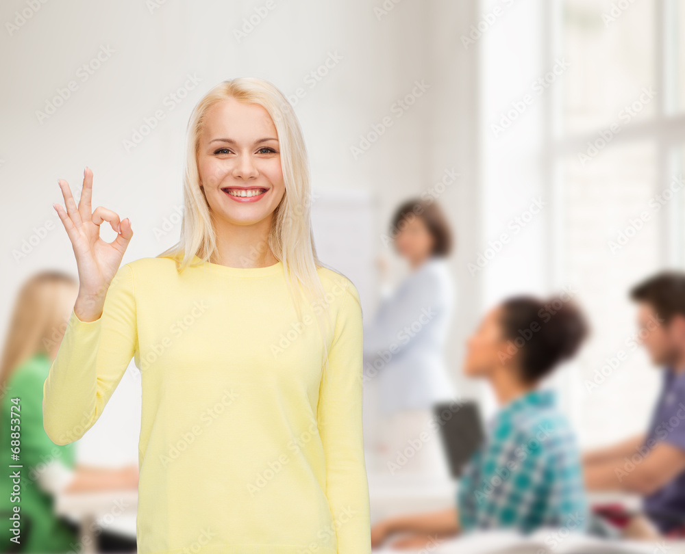 Poster young businesswoman showing ok sign