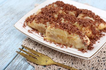 Sweetened fried banana on plate, close-up