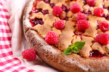 Tasty cake with berries on table close-up