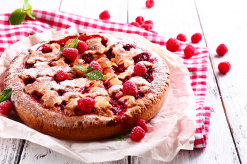 Tasty cake with berries on table close-up