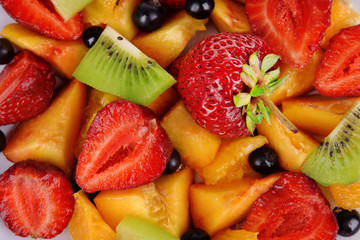 Fresh fruits salad on plate close up