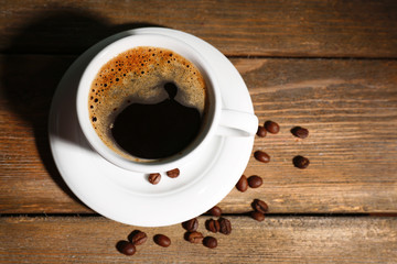 Cup of coffee on wooden background
