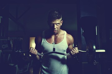 Guy doing exercises with barbell