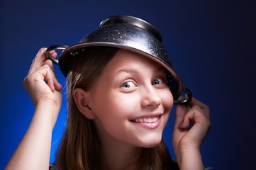 Girl with a colander on her head