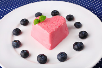 Heart shaped cake with blueberries