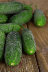 Cucumbers on wooden background