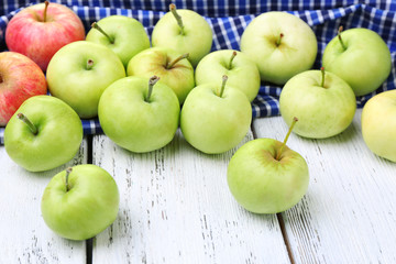 Ripe apples on wooden table close-up