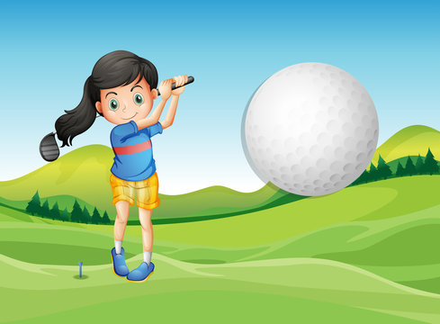 A young lady playing golf
