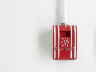 fire alarm switch on the white wall