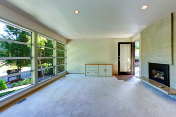 Empty house interior. Glass wall living room  with brick wall an