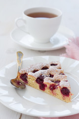 Cherry pie with a cup of tea