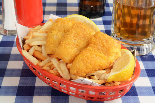 Fish And Chips Wrapped In Newspaper