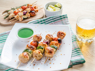 Grilled chicken skewers with zucchini and cherry tomatoes