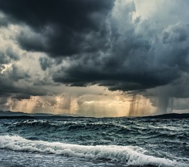 Heavy rain over stormy ocean