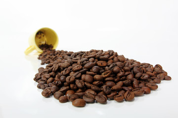 A cup of coffee with coffee beans.