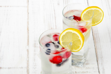 mineral water with fruit frozen in ice cubes