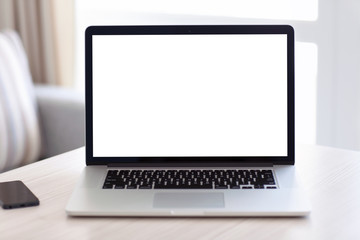 laptop with isolated screen is on the table in the room