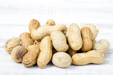 peanuts on a white wooden background