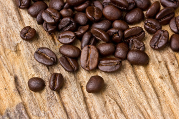 Coffee beans on wood background