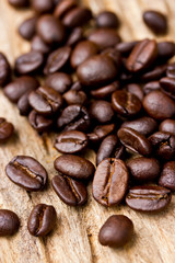 Coffee beans on wood background