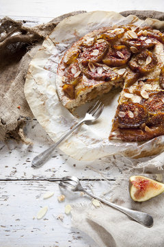 rustic stuffed figs pie covered with almonds and candied figs