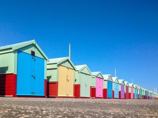 row of colourful beach huts