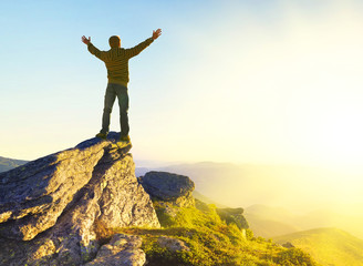 Winner on mountain peak. Sport and active life concept
