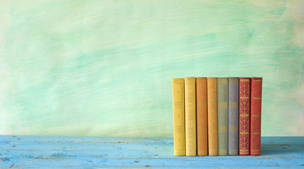 row of books, grungy background free copy space