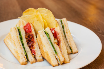 club sandwich with bacon and egg
