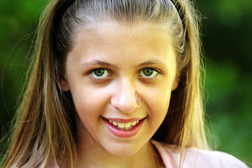 Fototapeta premium Portrait of a smiling beautiful young girl