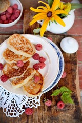 Fat pancakes with fresh raspberries