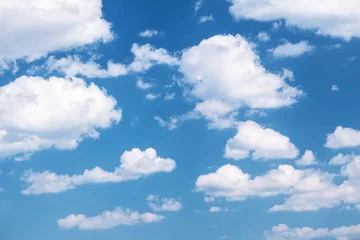 Foto auf Acrylglas Himmel Flauschige Wolken am blauen Himmel