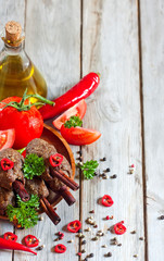 Kebab on cinnamon sticks background