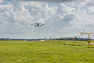 Fototapeta premium unidentified plane on landing approach at amsterdam airport