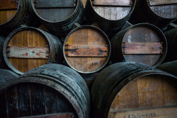 Wine barrels stacked in the cellar of the Quinta da Bacalhoa win
