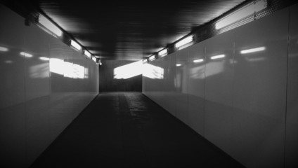 Dark empty underground pedestrian crossing tunnel