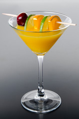Orange cocktail on a gray background