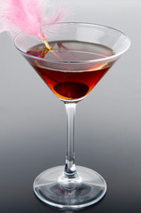 Cherry cocktail on a gray background